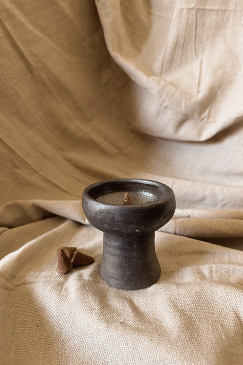 Copalerita handcrafted clay burner from Oaxaca styled on neutral linen with copal pieces.