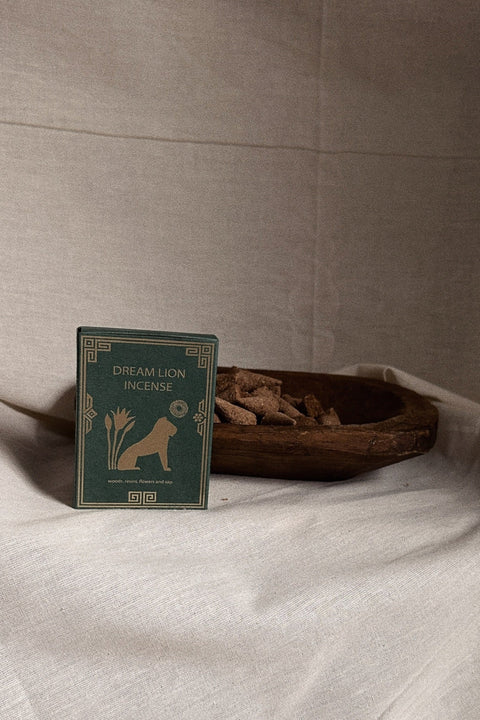 Dream Lion Incense Mayan Copal and Desert Sage box with incense cones on neutral linen background.