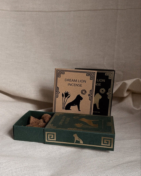 Dream Lion Incense assorted scent boxes and incense cones styled on neutral linen background.